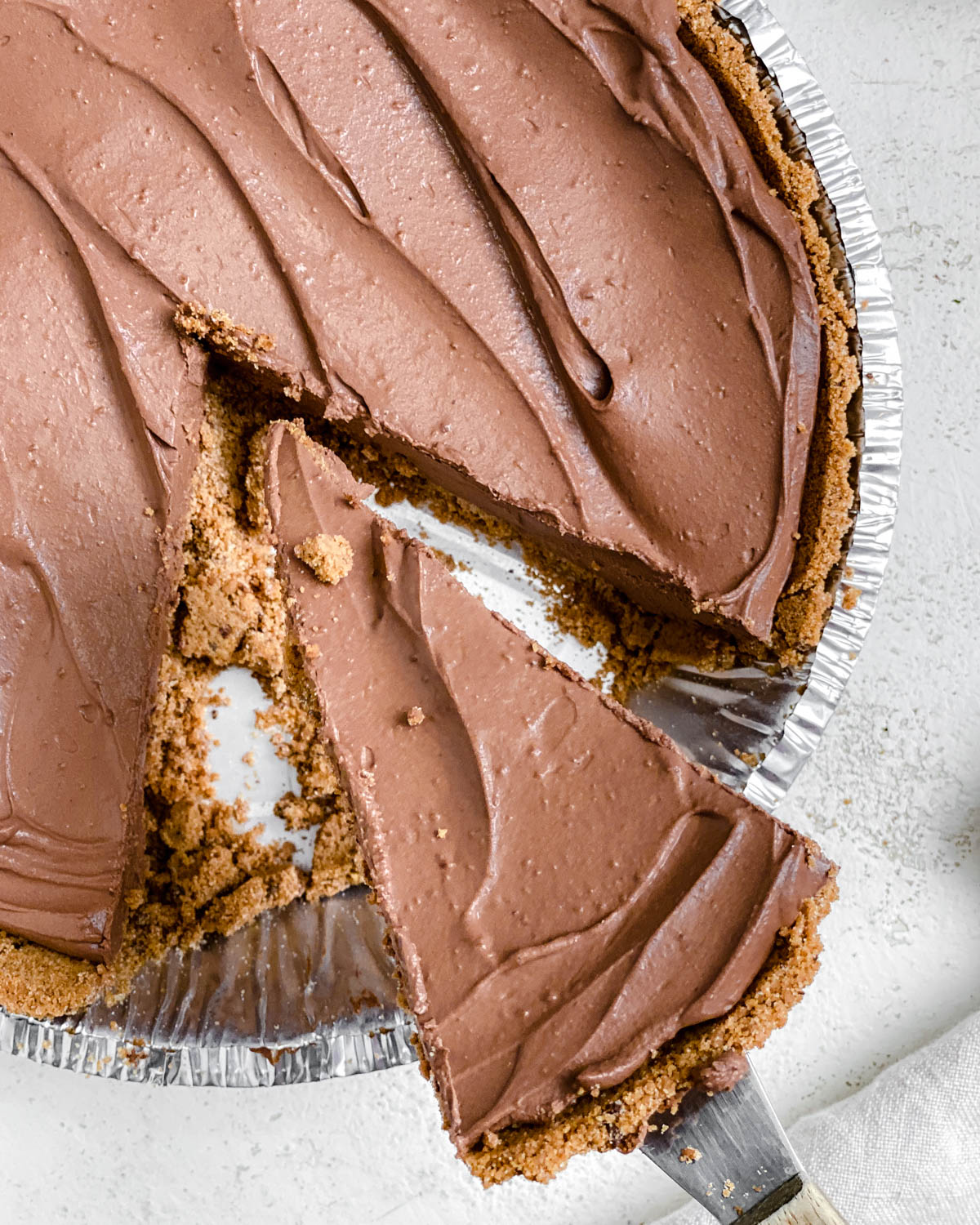 completed close up of a piece of Easy Vegan Chocolate Peanut Butter Pie