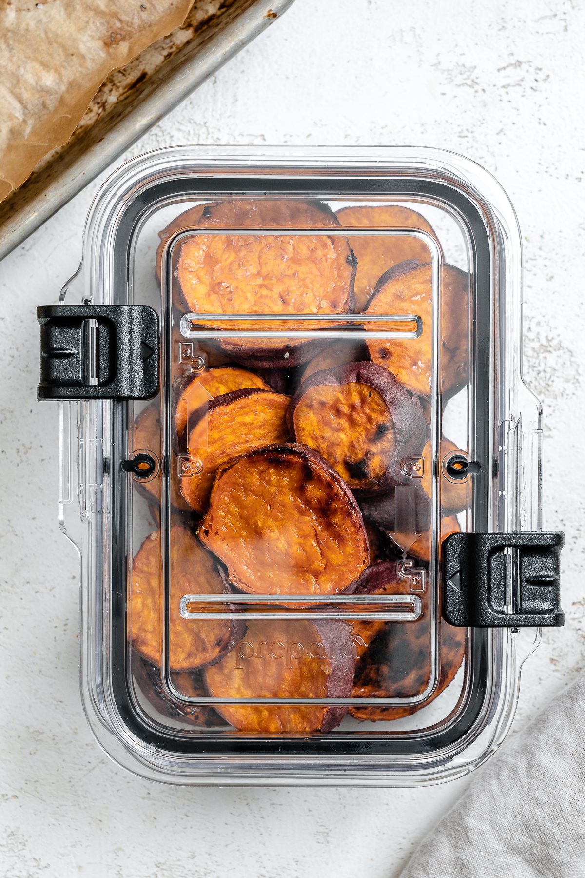 completed sweet potatoes in a container against a white background