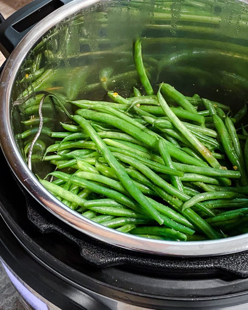 process shot of green beans cooking in pot