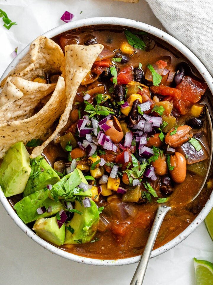 completed Easy Vegan Taco Soup in a bowl against a light surface