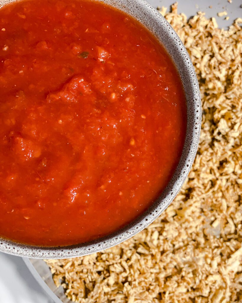 process shot of adding salsa to pan