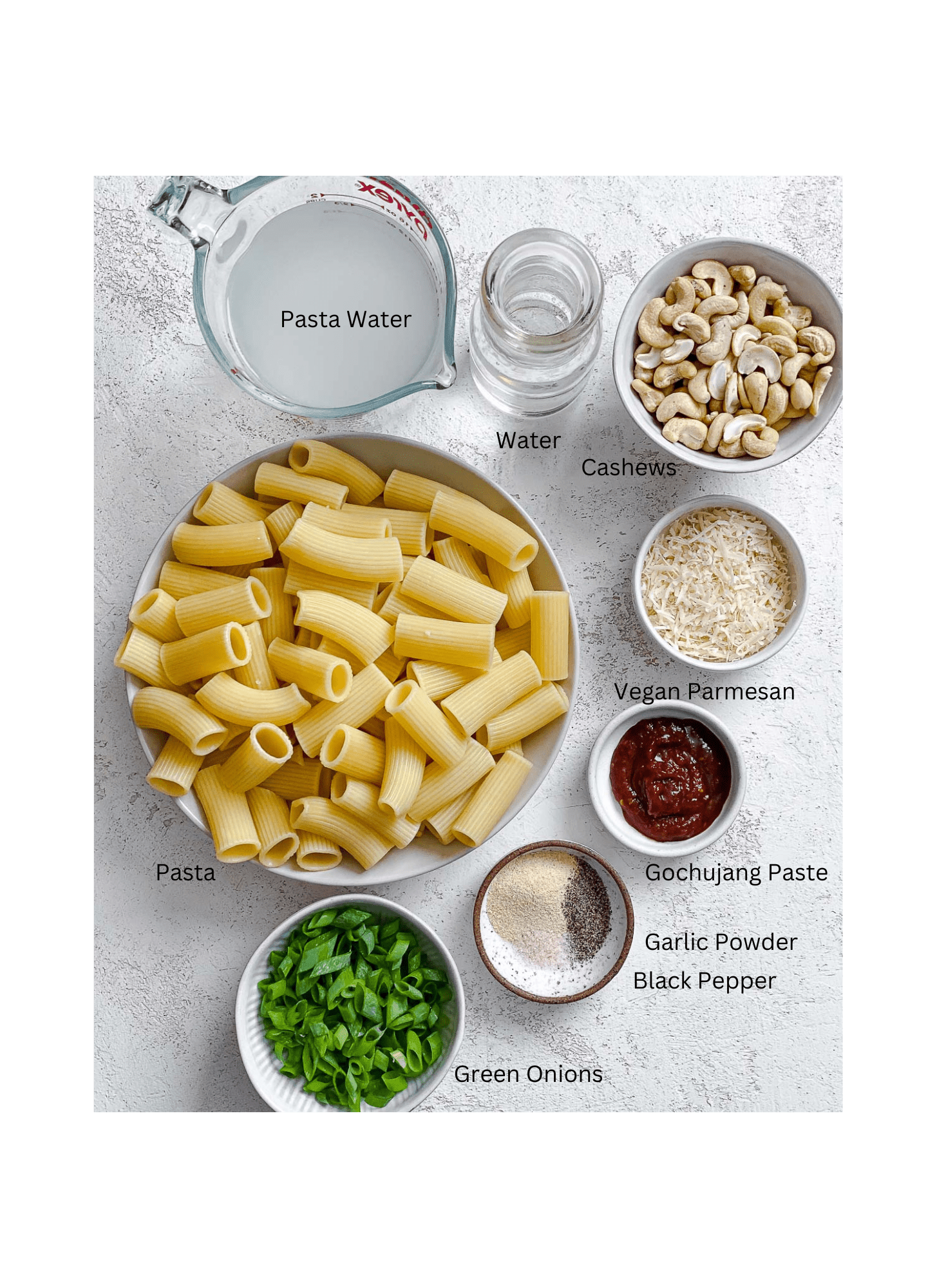 ingredients for Creamy Gochujang Pasta measured out against a white surface