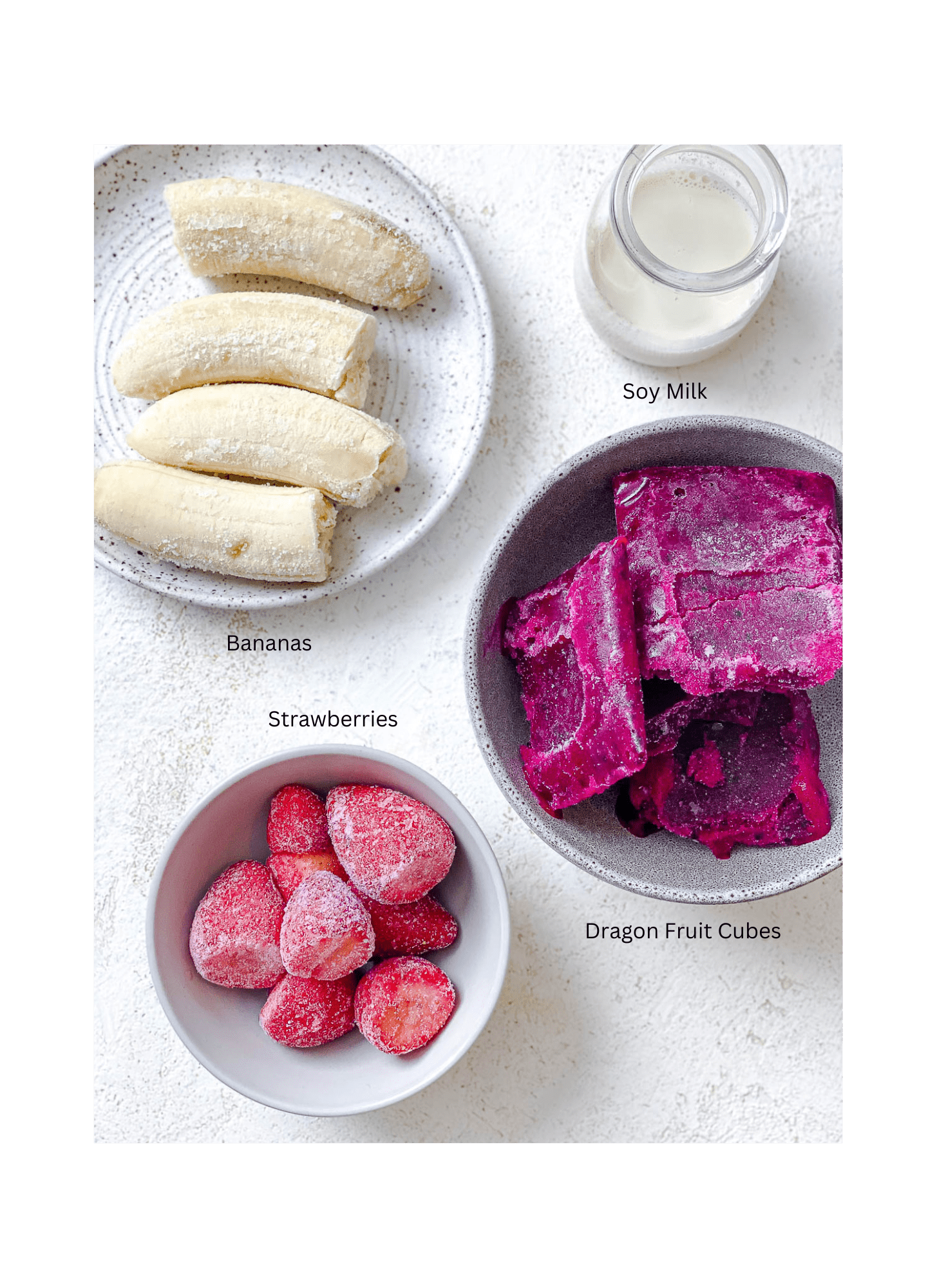ingredients for Dragon Fruit Smoothie Bowl (Pitaya Bowl) measured out against a white surface