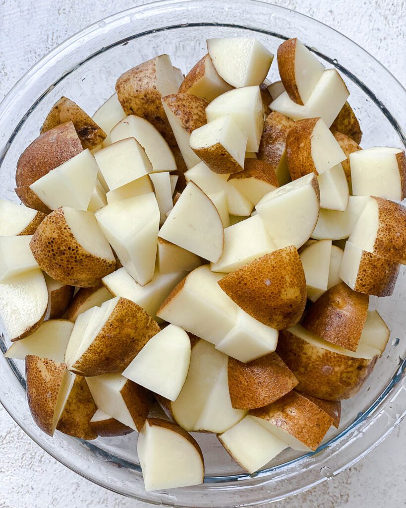 cubed potatoes in a glass bowl