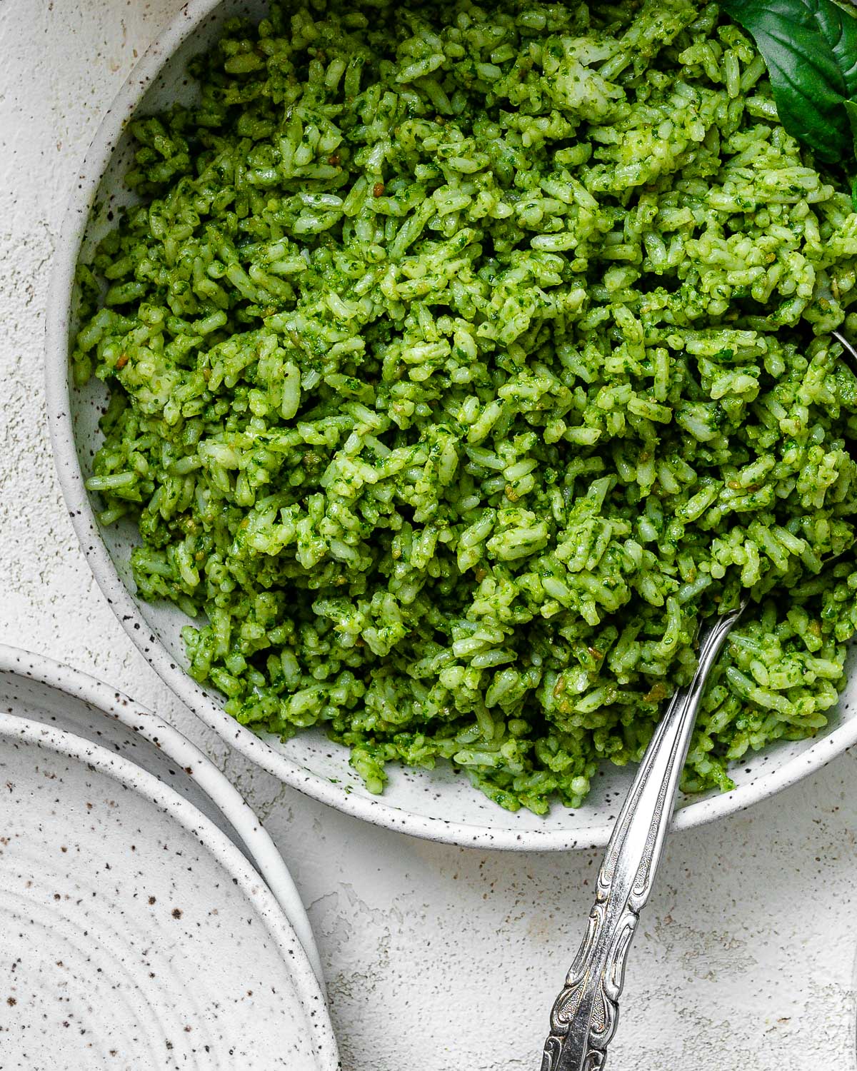 completed pesto rice against a light surface