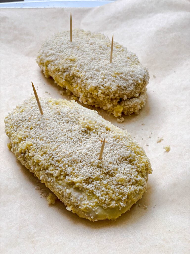 process shot of adding Vegan Cordon Bleu to baking sheet