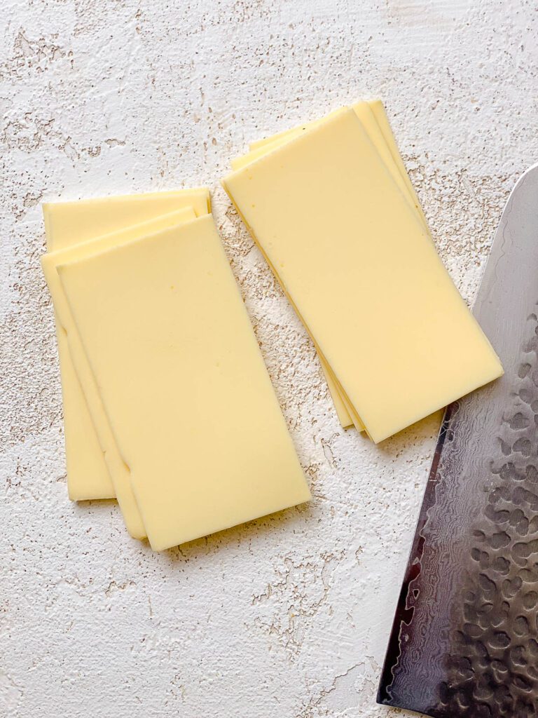 process shot showing sliced vegan cheese