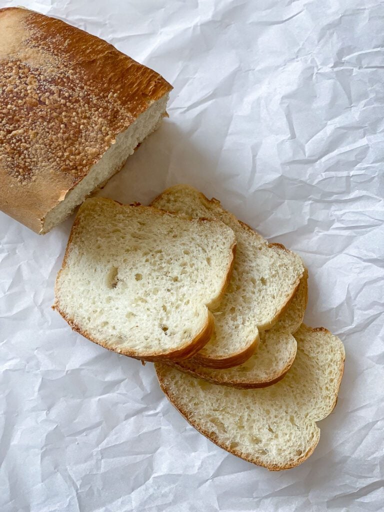 process shot showing sliced bread against white surface