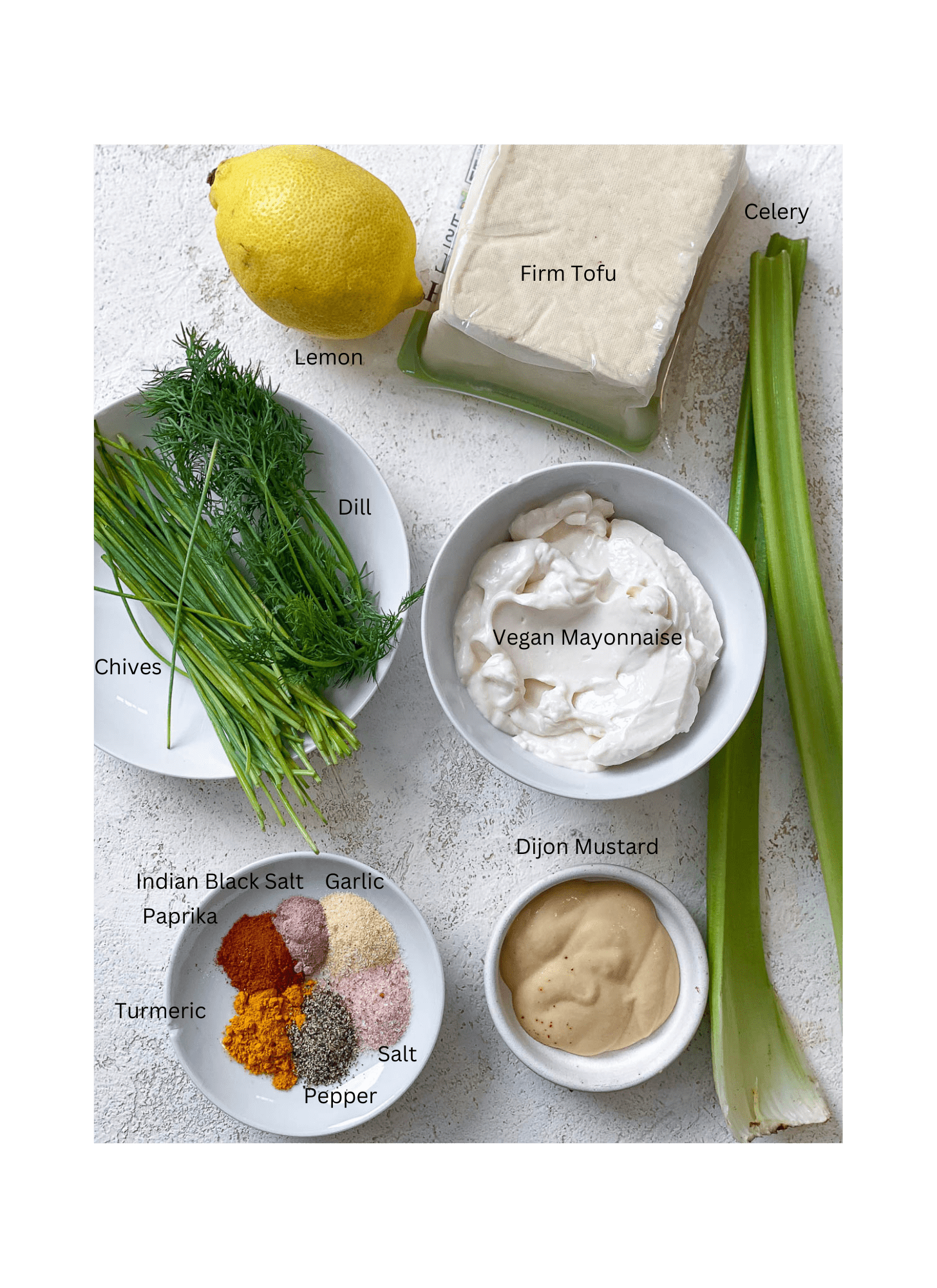 ingredients for The BEST Vegan Egg Salad measured out against a white surface