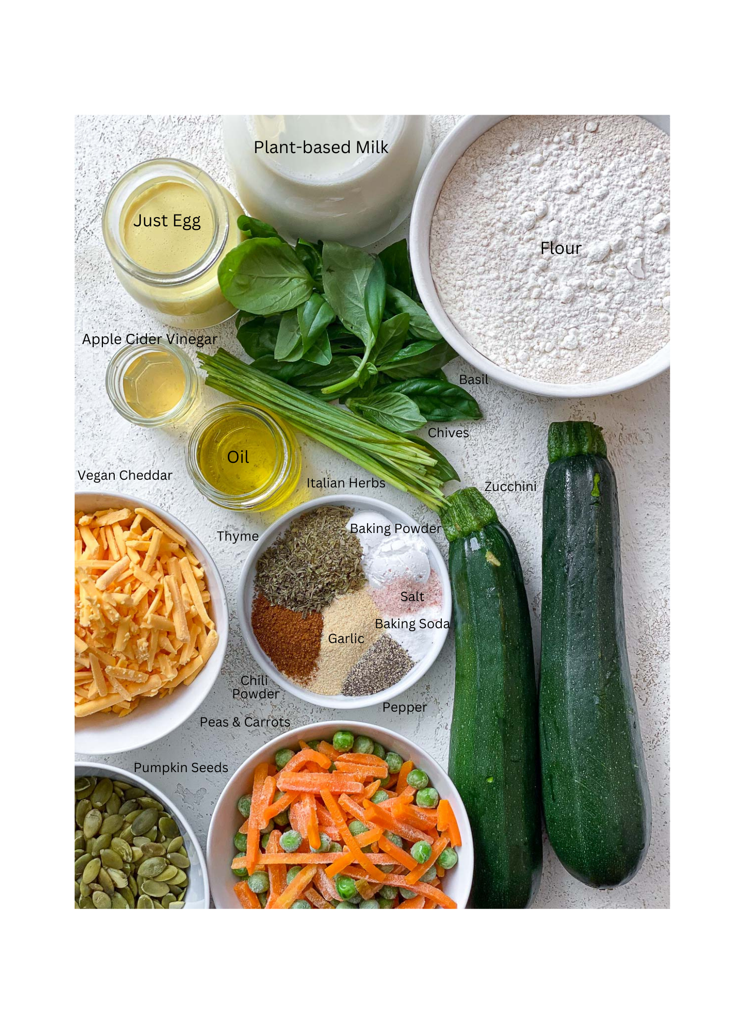 ingredients for Healthy Veggie Muffins measured out against a white surface