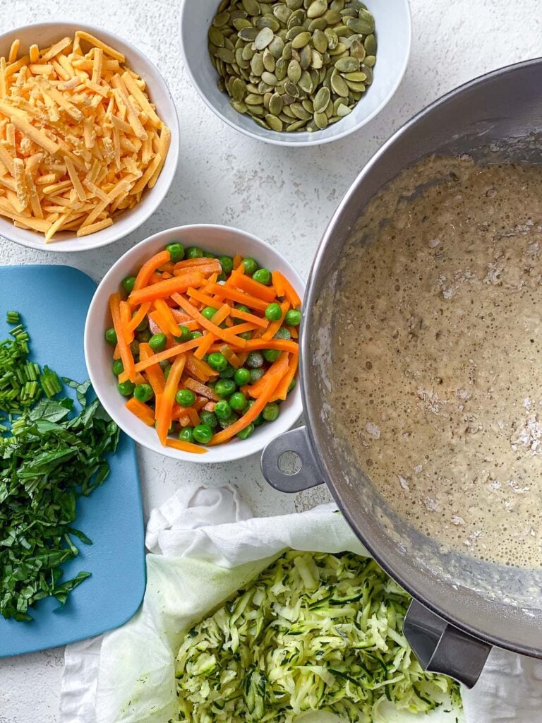 ingredients for Healthy Veggie Muffins measured out against a white surface