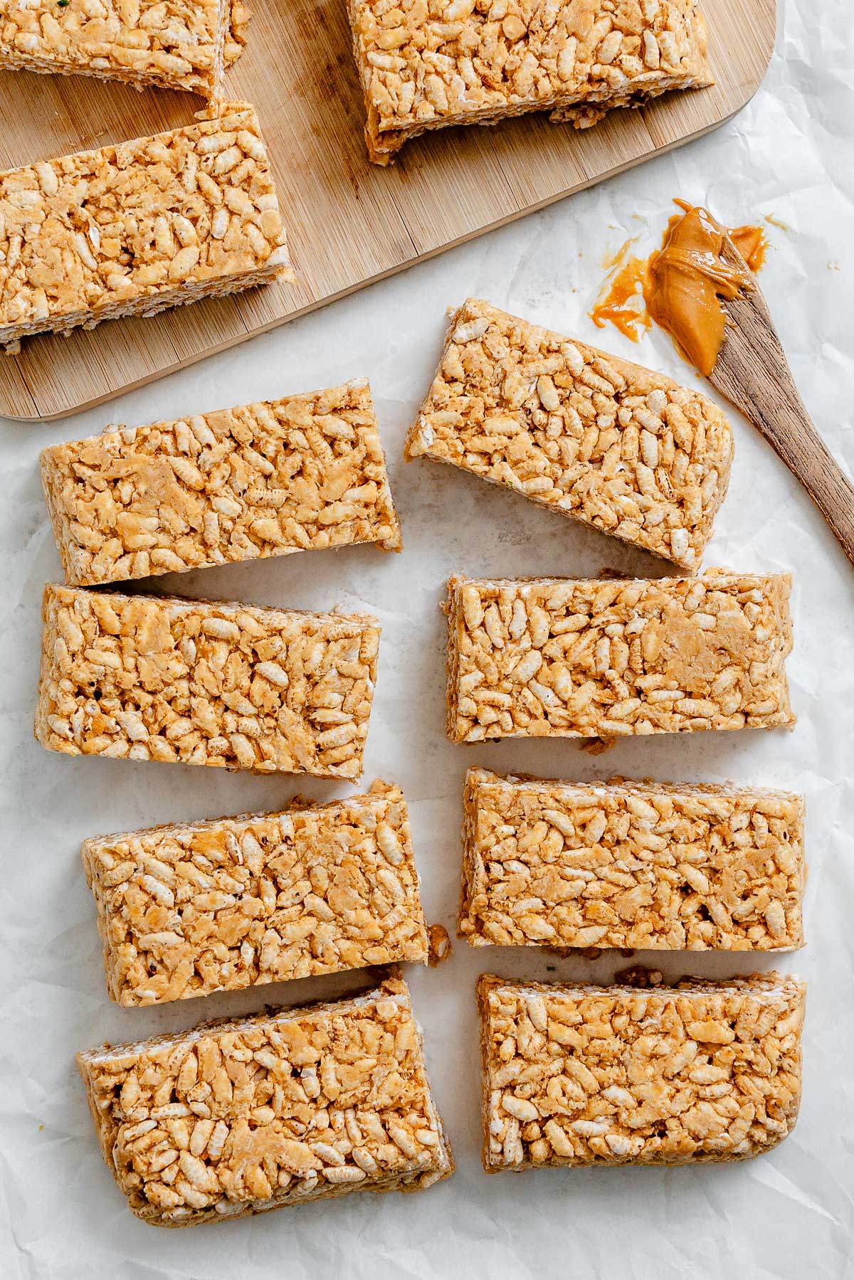 several completed Peanut Butter Rice Krispie Treats against a white surface