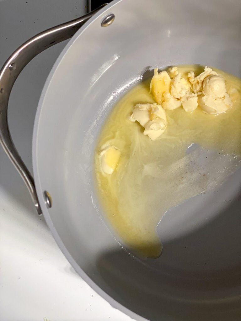 process shot of butter melting in a pot