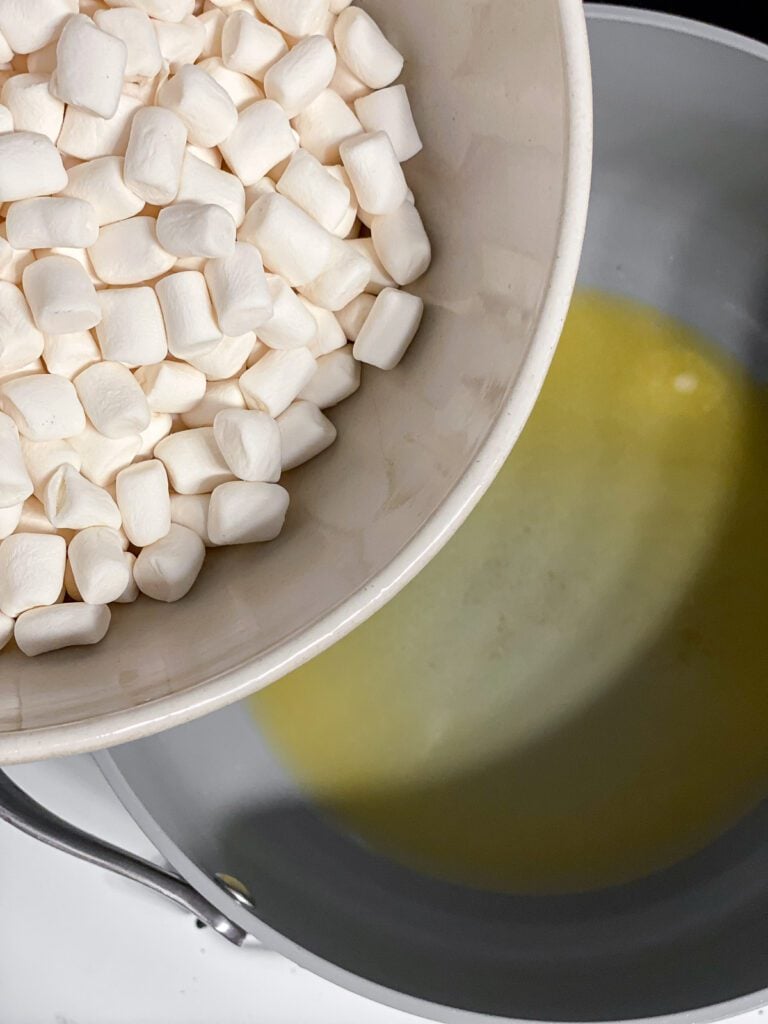 process shot of adding marshmallows in pot