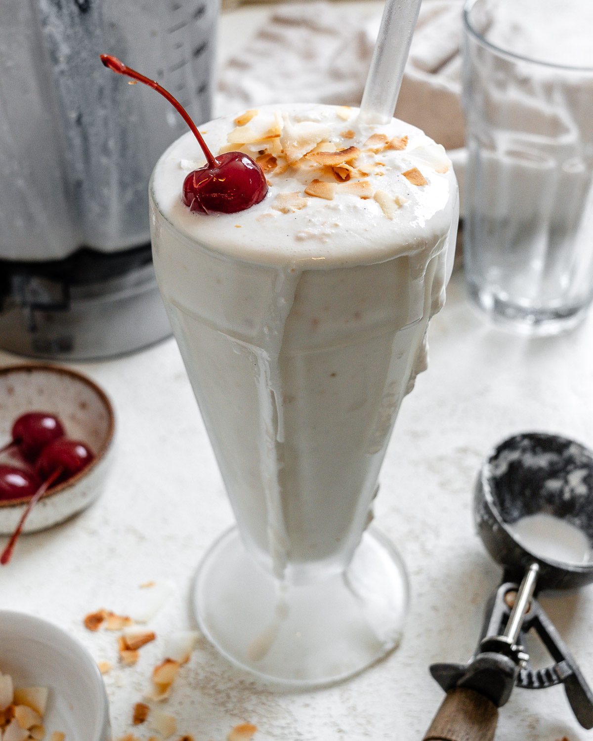 completed Coconut Shake in a cup against a white surface