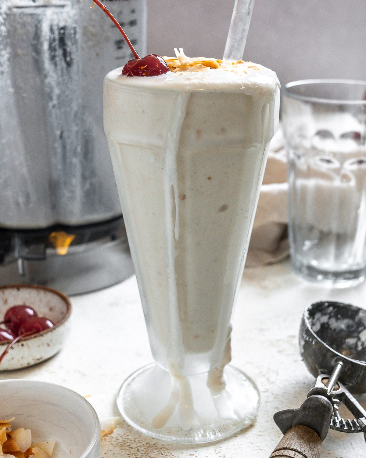 completed Coconut Shake in a cup against a white surface