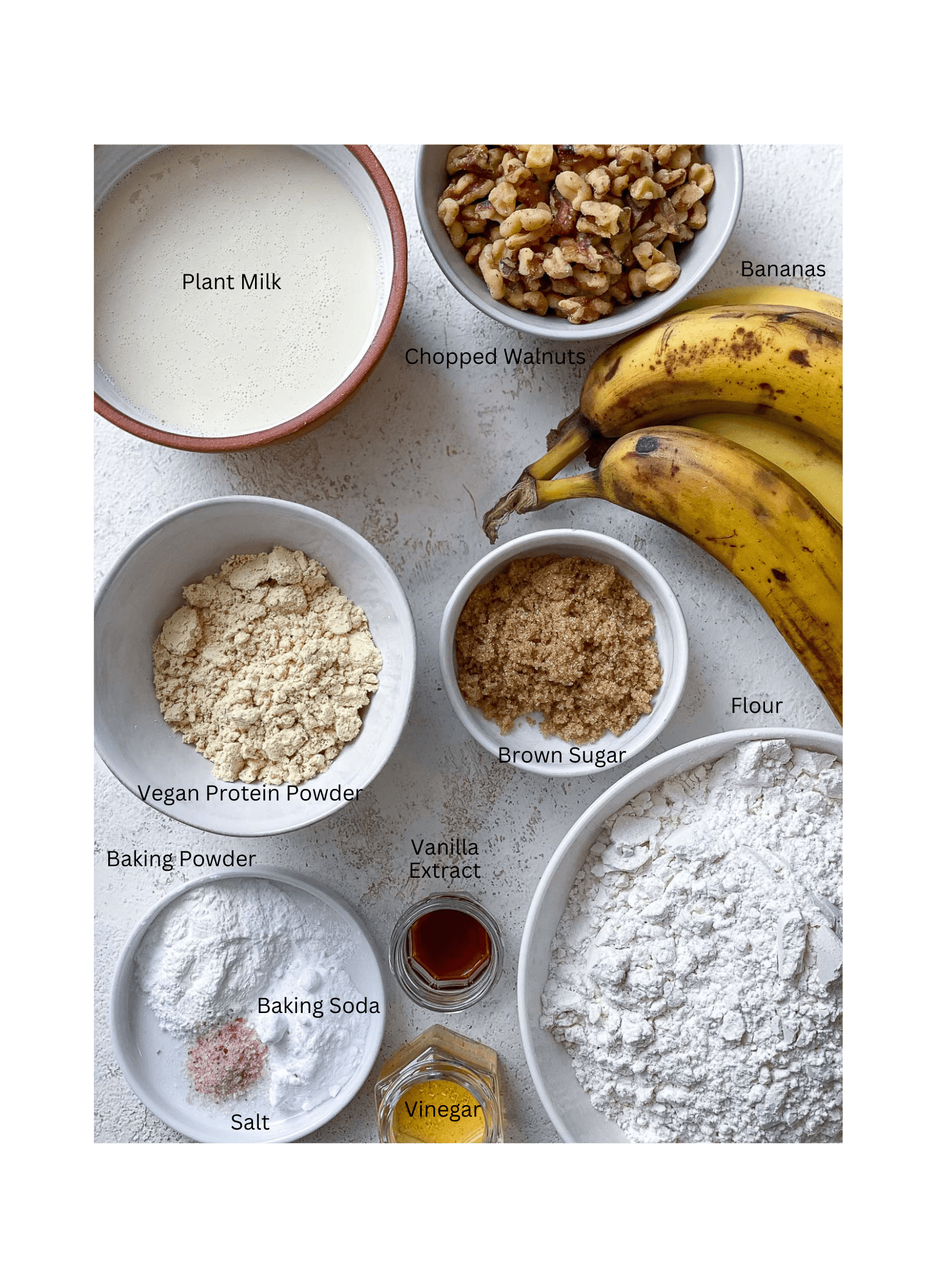 ingredients for Easy Protein Banana Bread measured out on a white surface