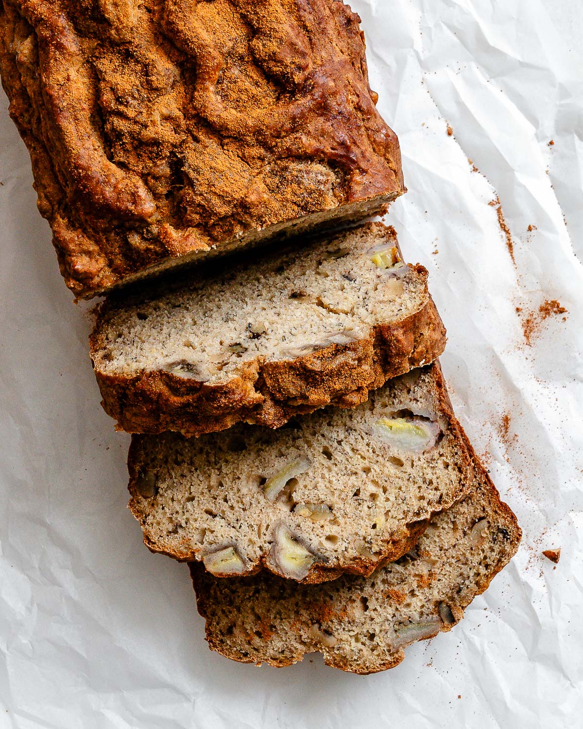 completed sliced Easy Protein Banana Bread on a white surface