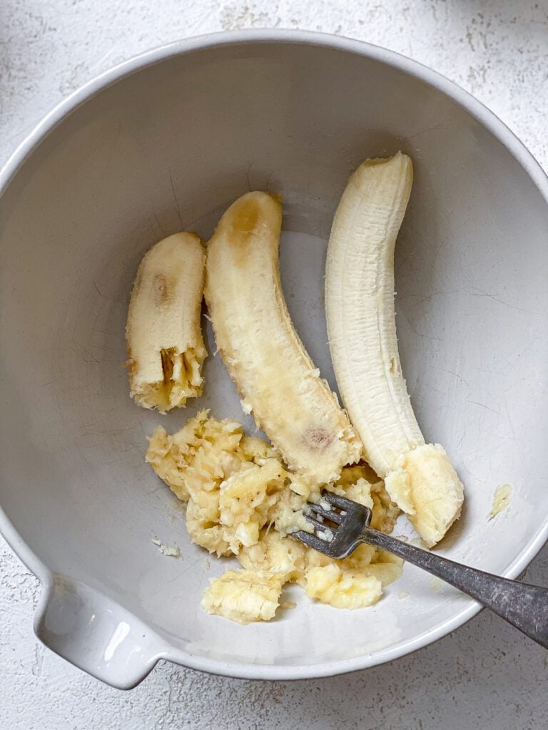 process shot of mashing banana in a bowl