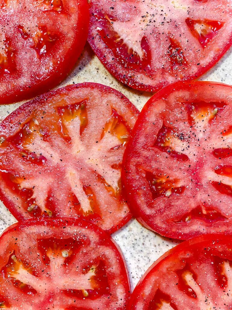 seasoned tomatoes on white surface