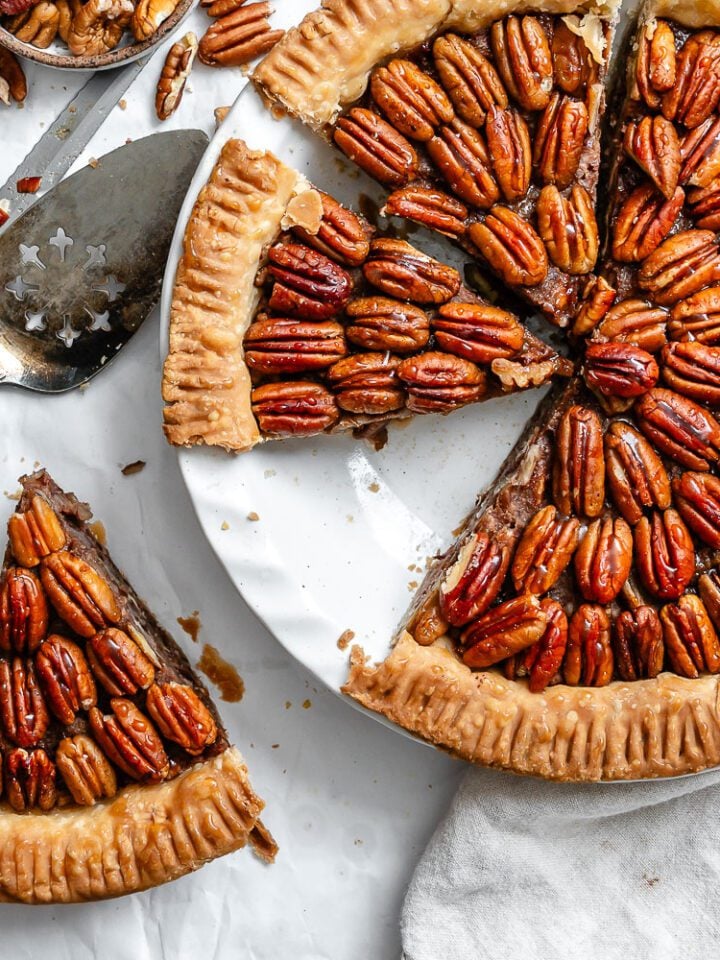completed Vegan Pecan Pie (No Corn Syrup!) on white surface