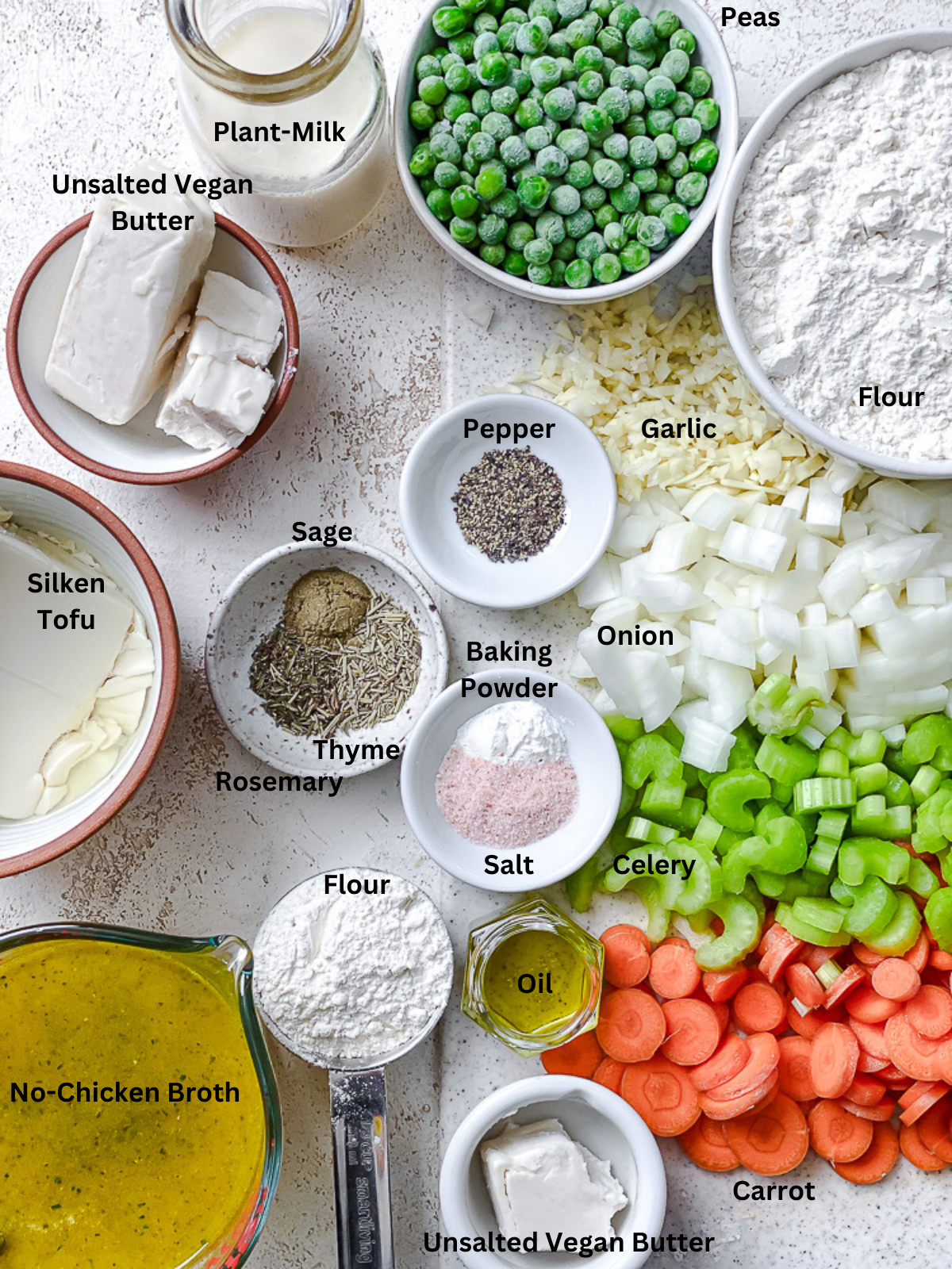 ingredients for Vegan Chicken and Dumplings measured out on a white surface