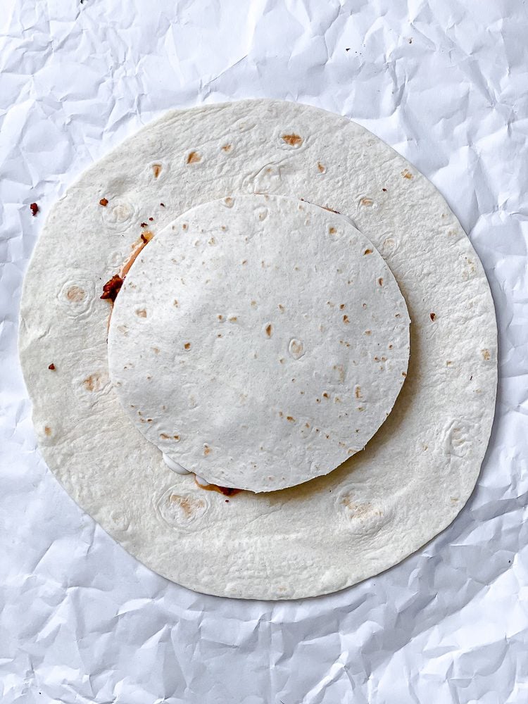 process shot showing tortilla added to crunchwrap