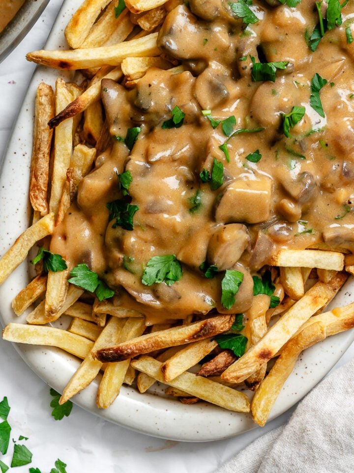 completed Vegan Poutine on a white platter