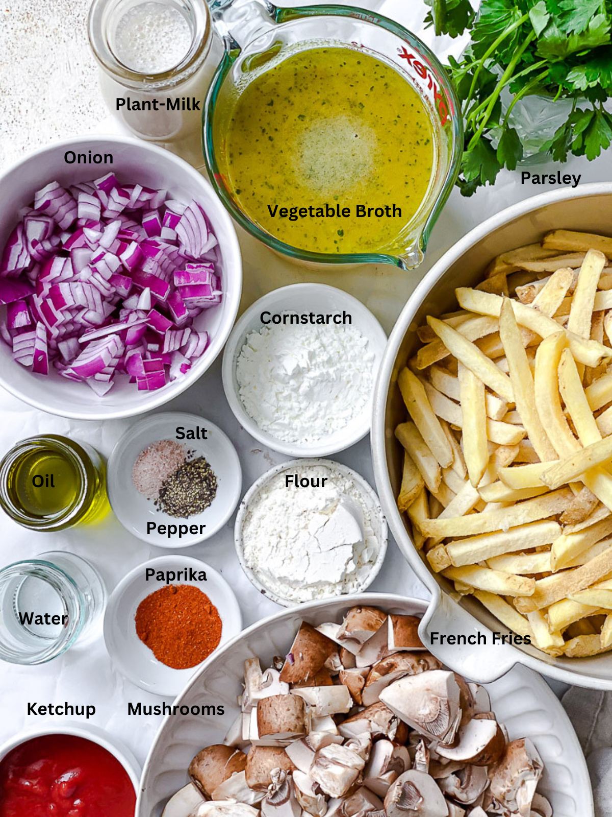 ingredients for Vegan Poutine measured out on a white surface