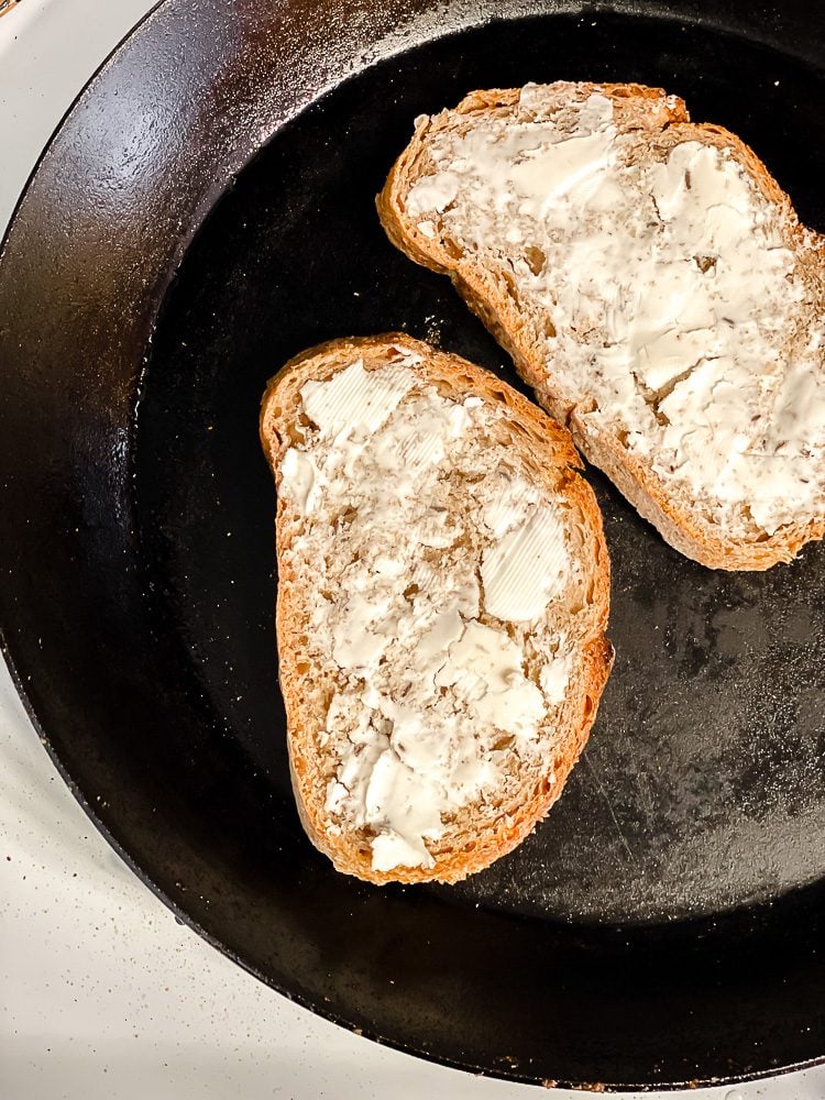 process shot showing vegan butter on bread on skillet