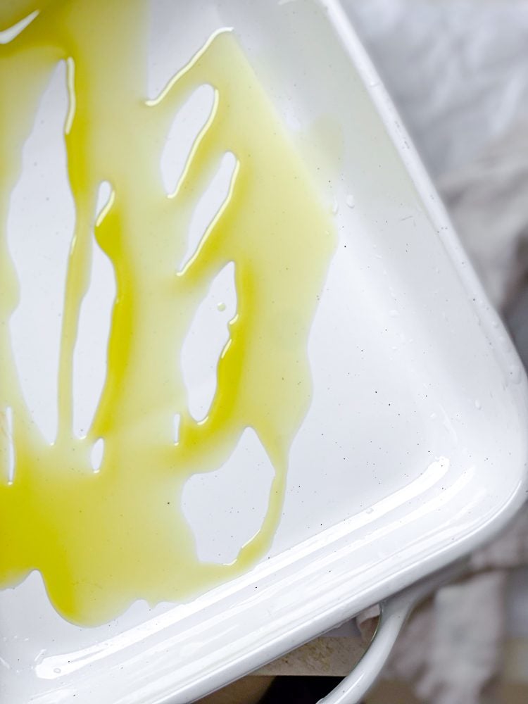 process shot showing olive oil in baking dish