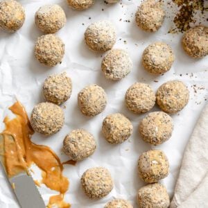 completed Peanut Butter Protein Balls with Oatmeal on white surface