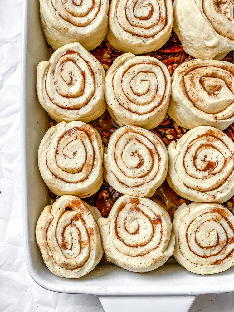 process shot showing sticky buns in baking pan