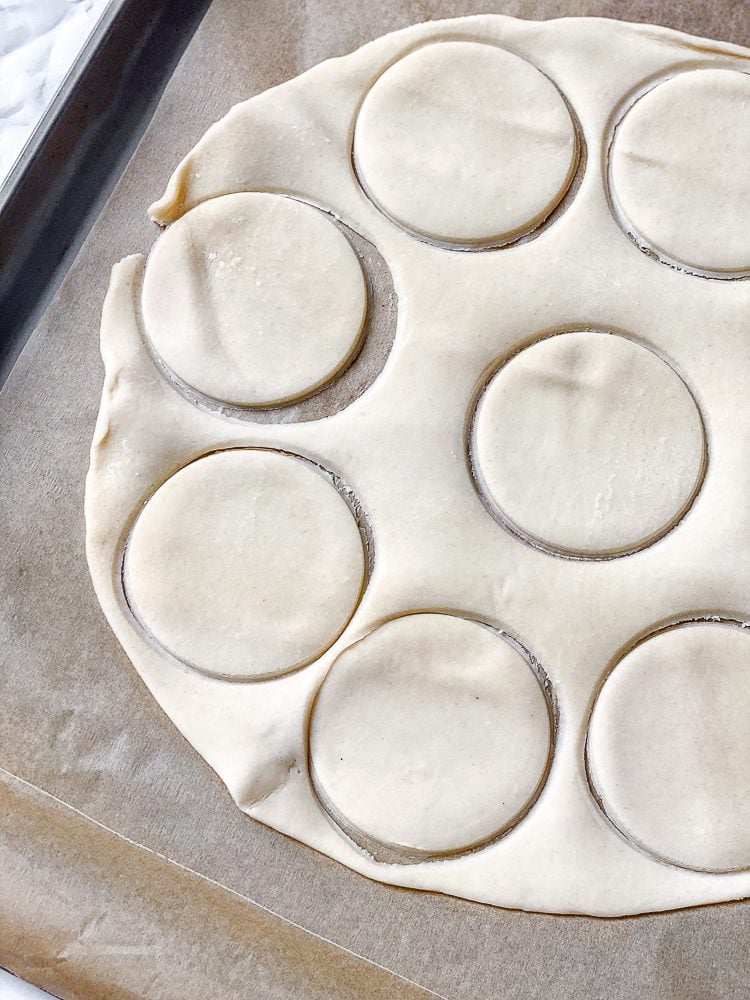 process shot showing circular cut outs of dough