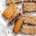 completed Easy Blueberry Pie Bars on a white surface
