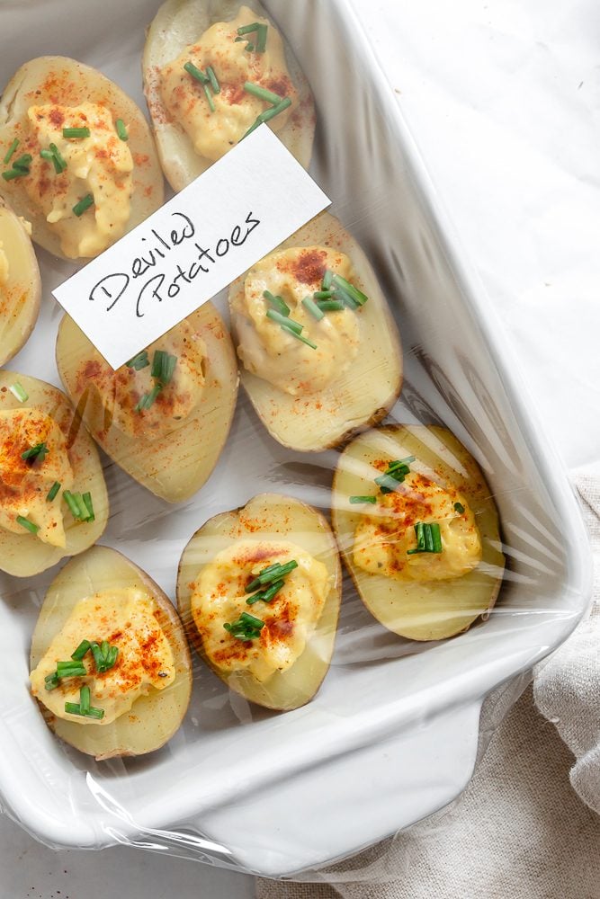 completed Deviled Potatoes in a storage container