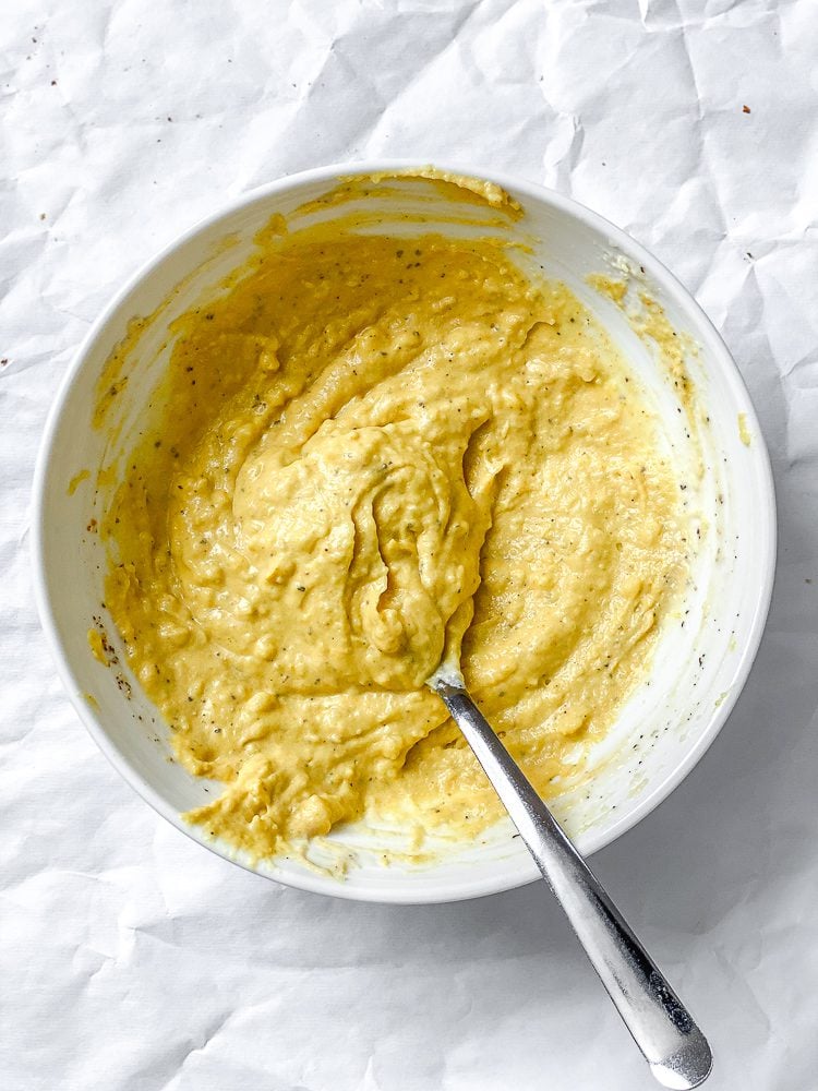 process shot showing mixing ingredients together in a bowl