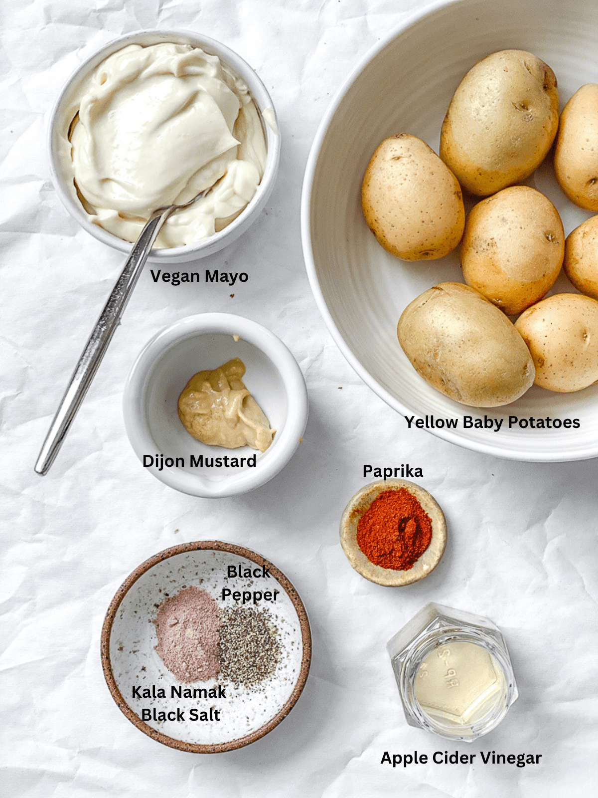 ingredients for Deviled Potatoes measured out on a white surface