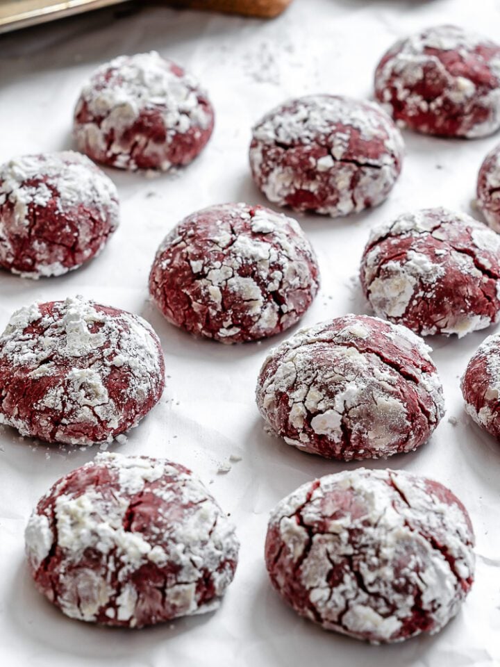 completed Red Velvet Crinkle Cookies on a white surface