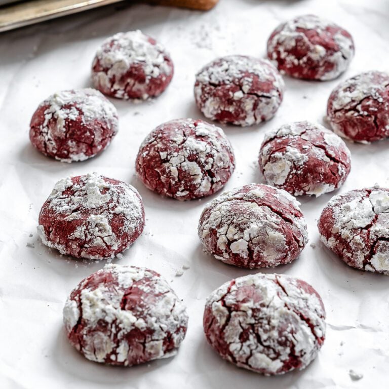 completed Red Velvet Crinkle Cookies on a white surface