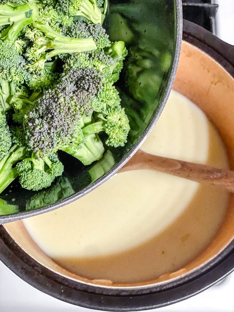 process shot showing adding broccoli to pot