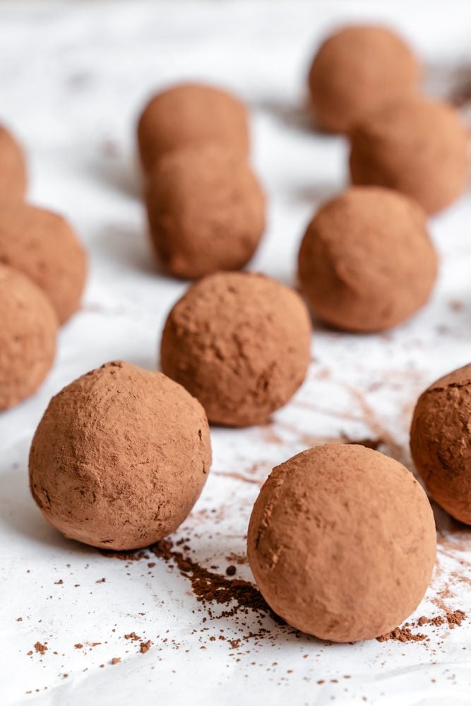 Completed Vegan Chocolate Truffles on a white surface.