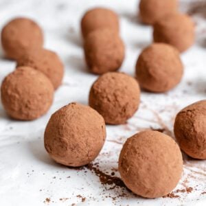 Completed Vegan Chocolate Truffles on a white surface.