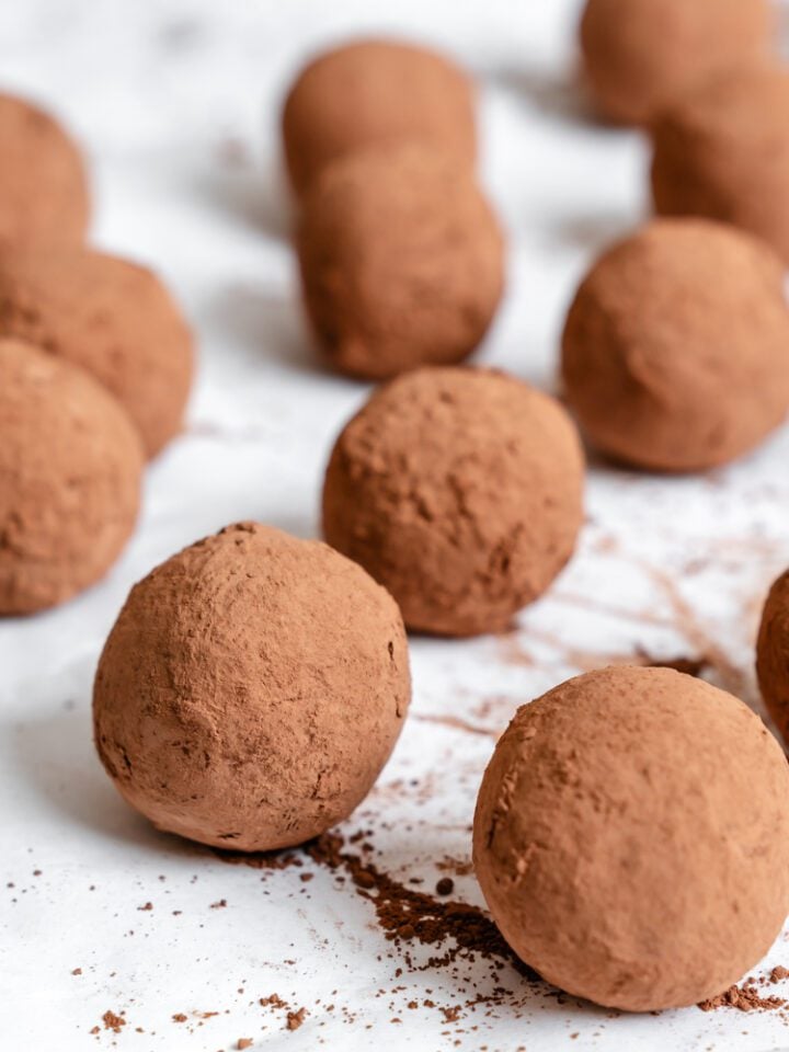 Completed Vegan Chocolate Truffles on a white surface.
