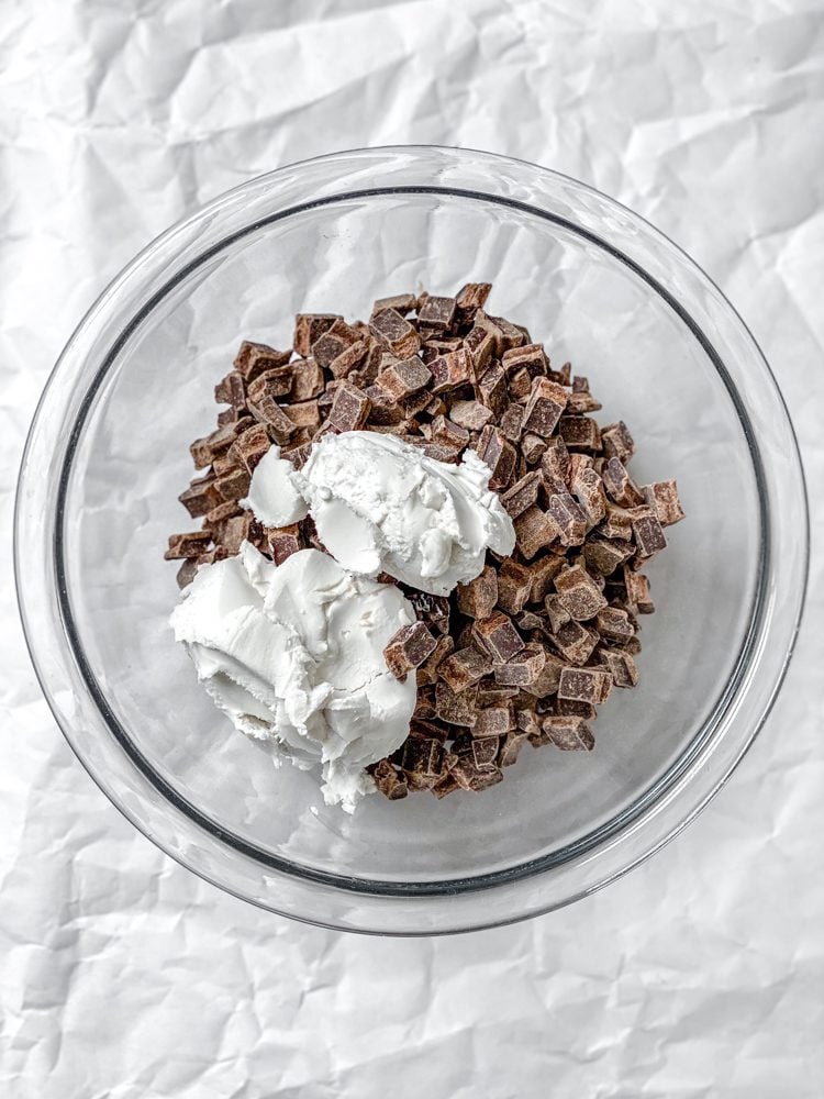 Process shot showing ingredients added to a bowl.