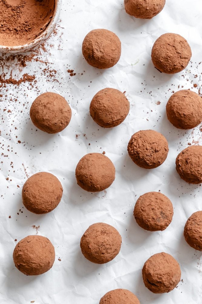 Completed Vegan Chocolate Truffles on a white surface.