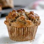 completed Vegan Banana Oatmeal Muffin on a white surface