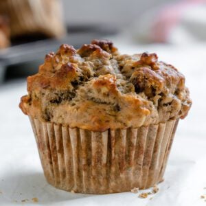 completed Vegan Banana Oatmeal Muffin on a white surface