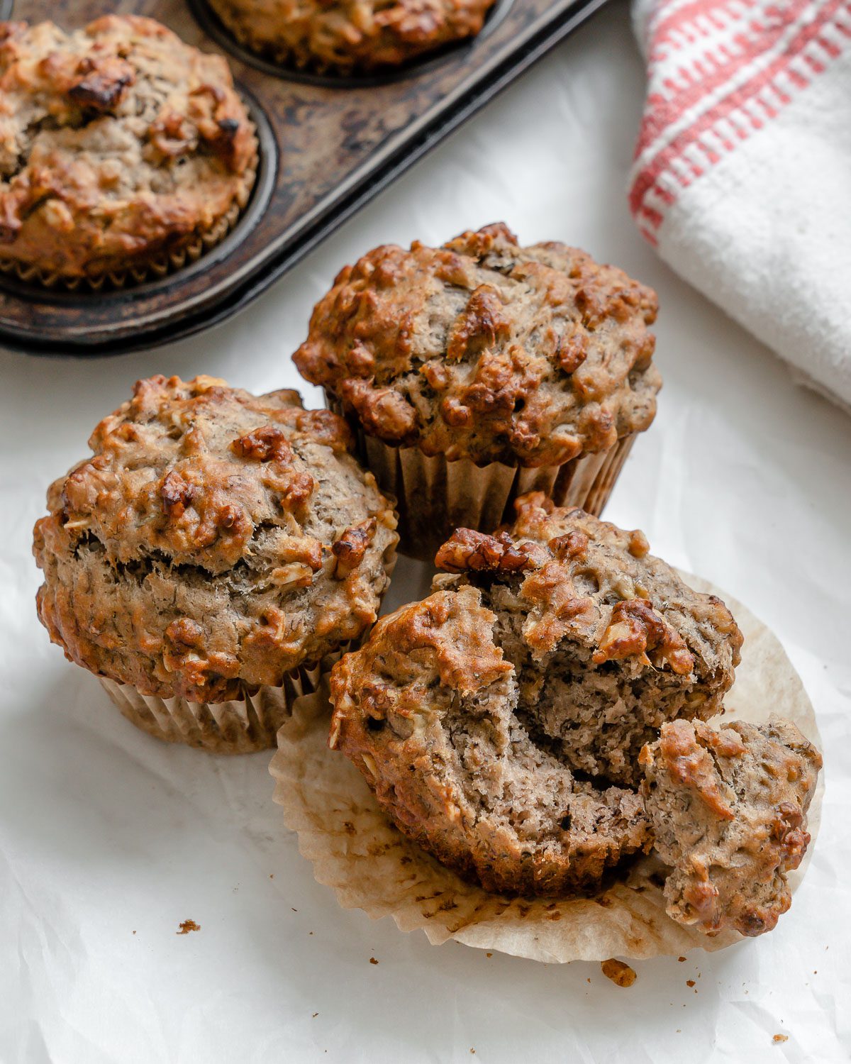 completed Vegan Banana Oatmeal Muffins on a white surface