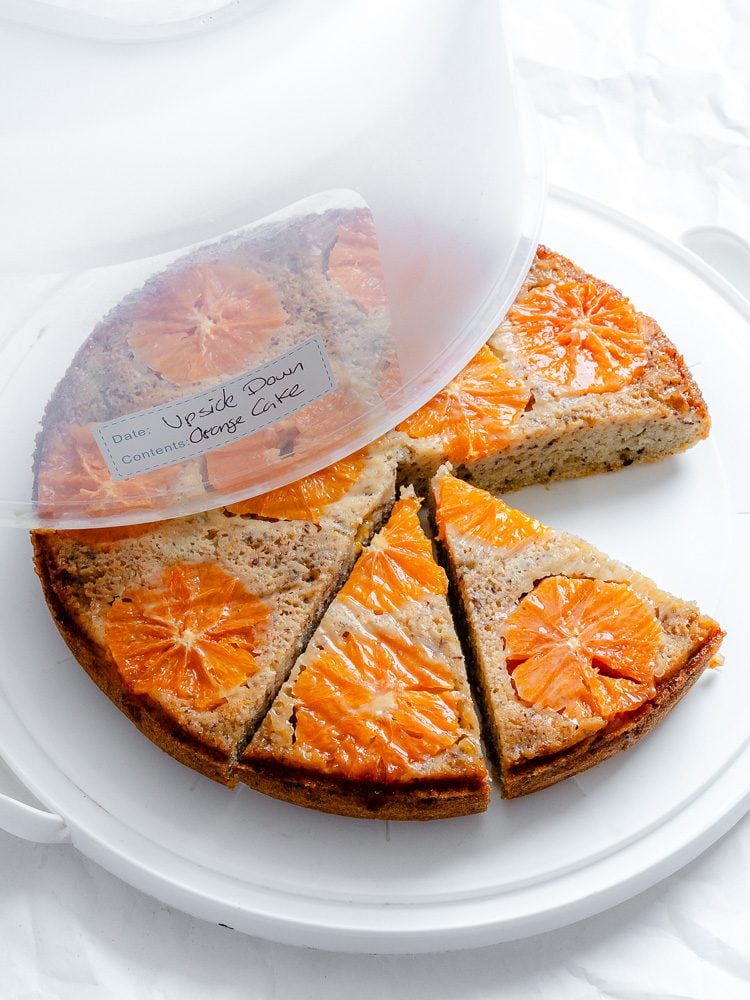 completed Orange Upside Down Cake in a storage container